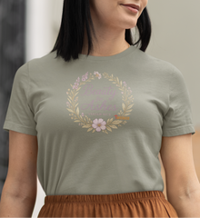 Inspirational Christian apparel with Bible verse Isaiah 61:3 surrounded by flowers and leaves.