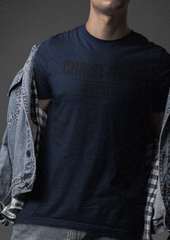 Faith-based Christian shirt with understated lettering, perfect for men and women who live their creed.