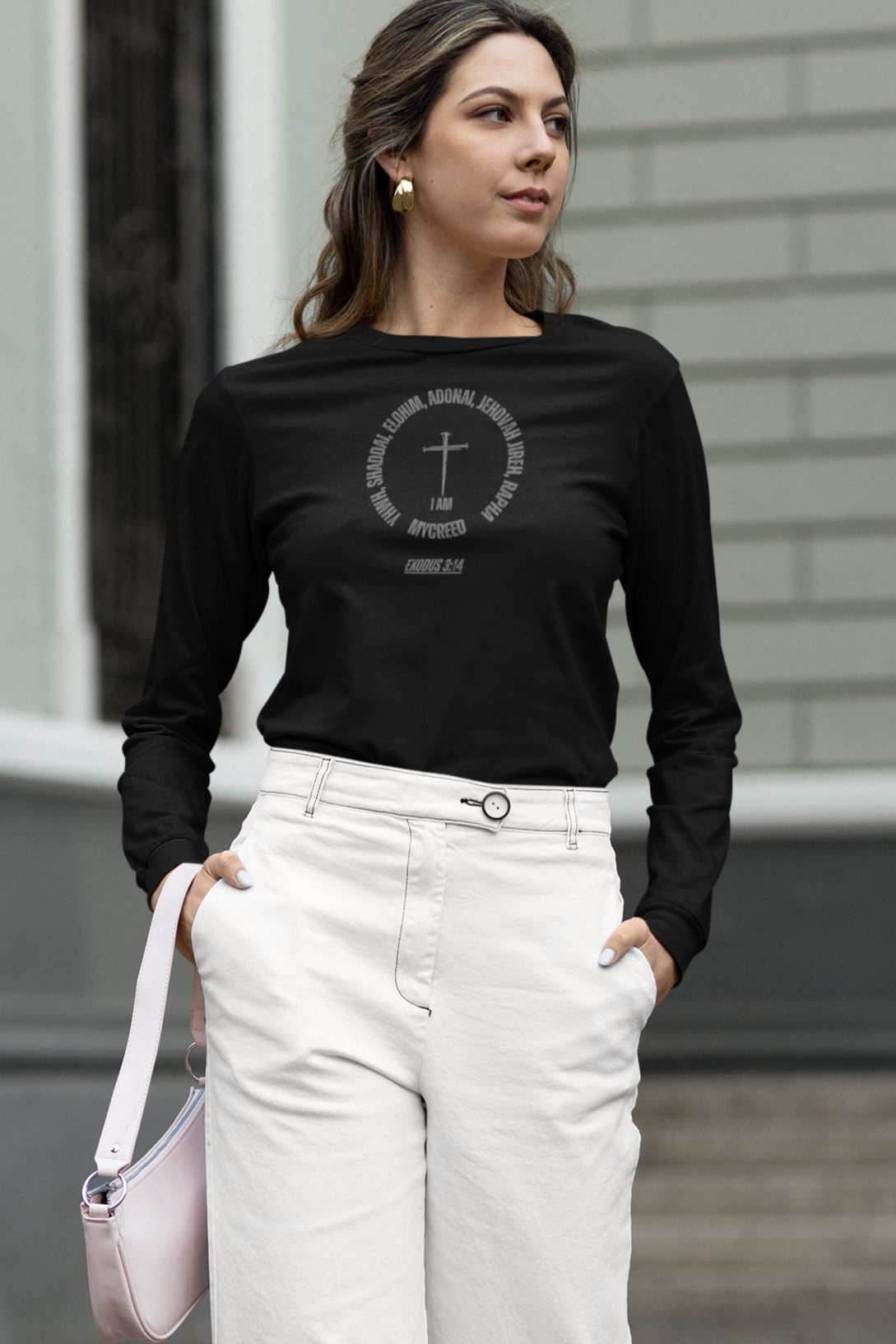 Women’s slim fit Christian long sleeve shirt with elegant “Names of God” graphic print across the chest.