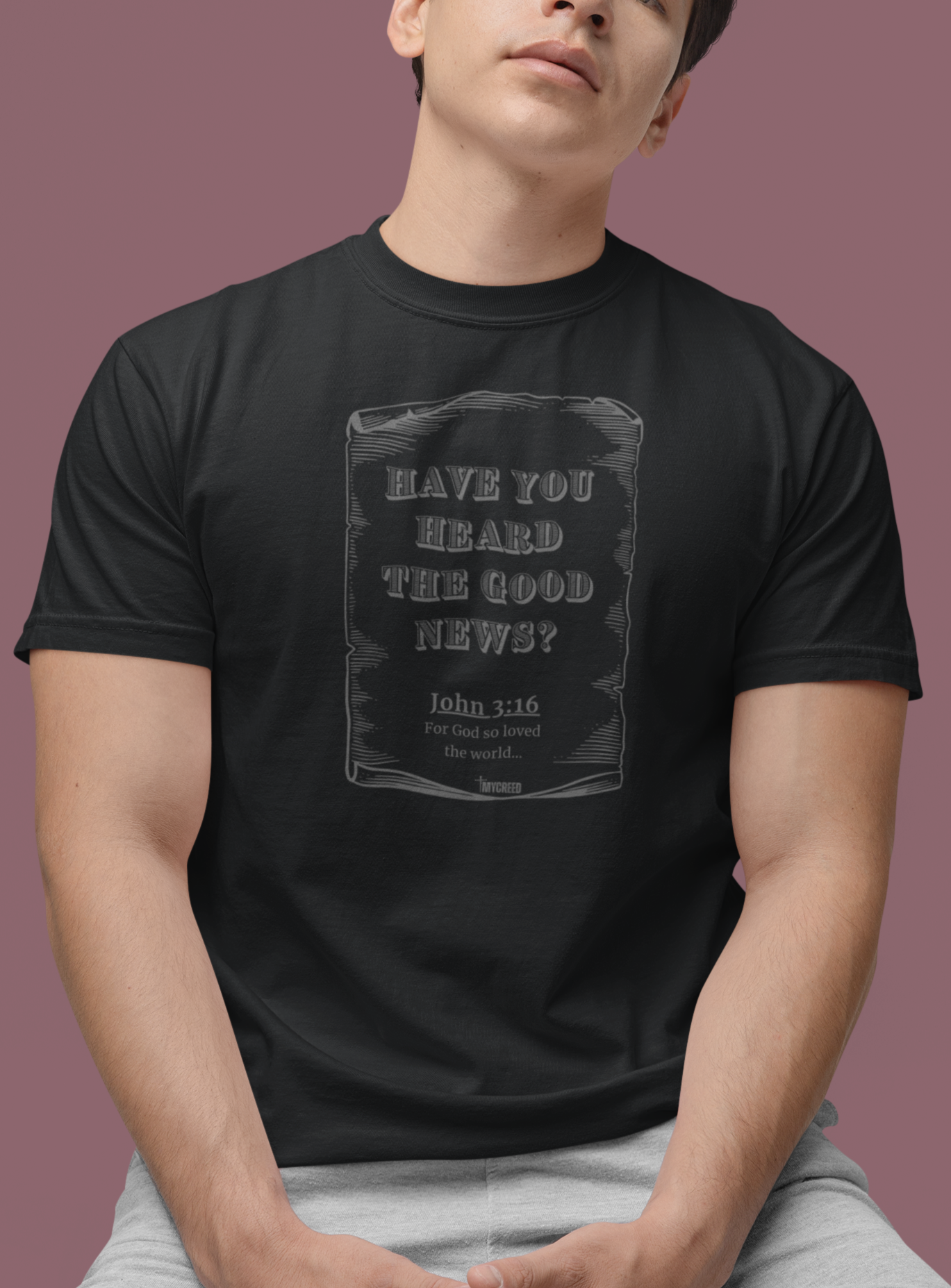 The Good News 3:16 Christian t-shirt by MyCreed with vintage scroll and John 3:16 on Graphite Black Comfort Colors 1717 garment-dyed tee.