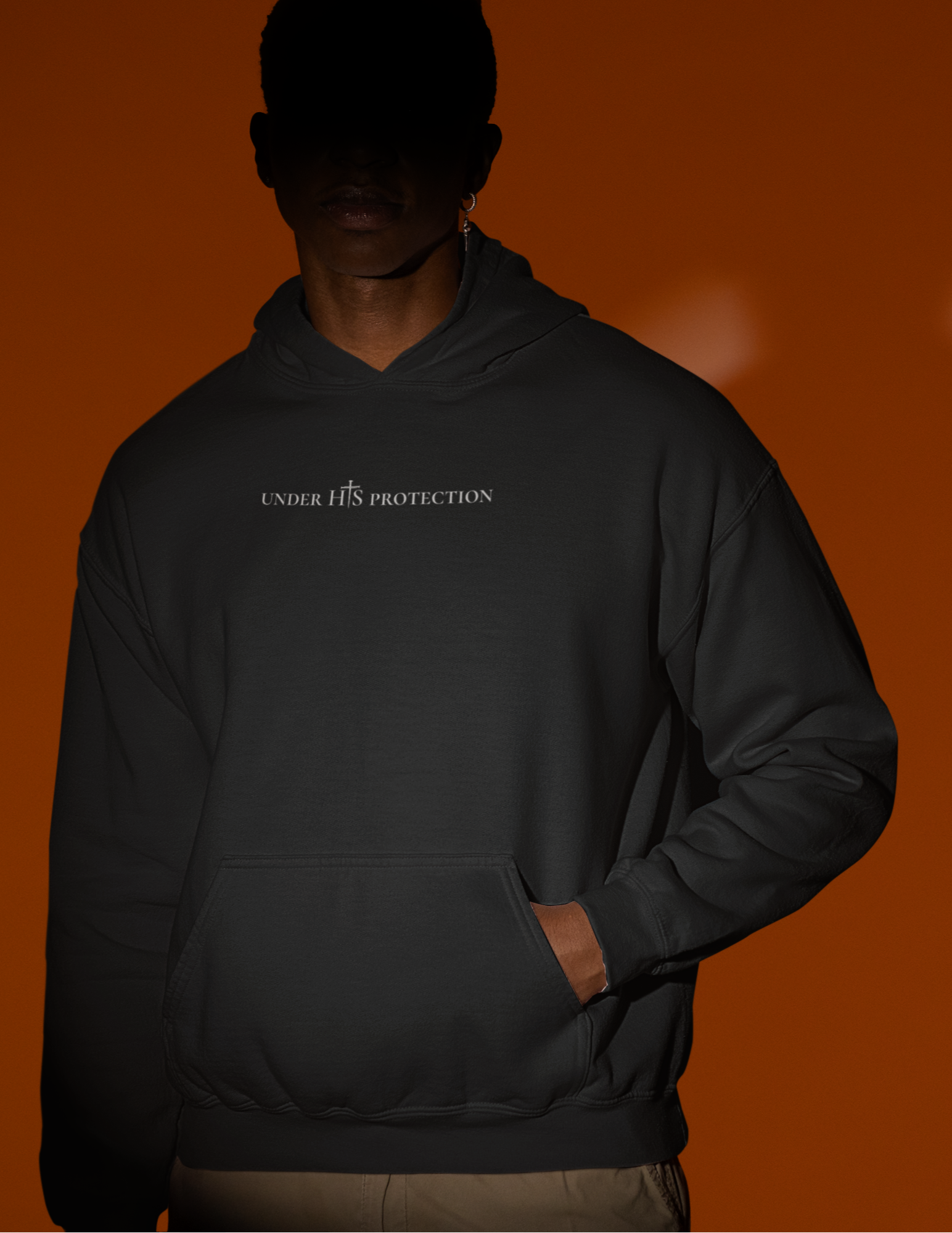 Faith-inspired streetwear hoodie declaring God’s protection.
