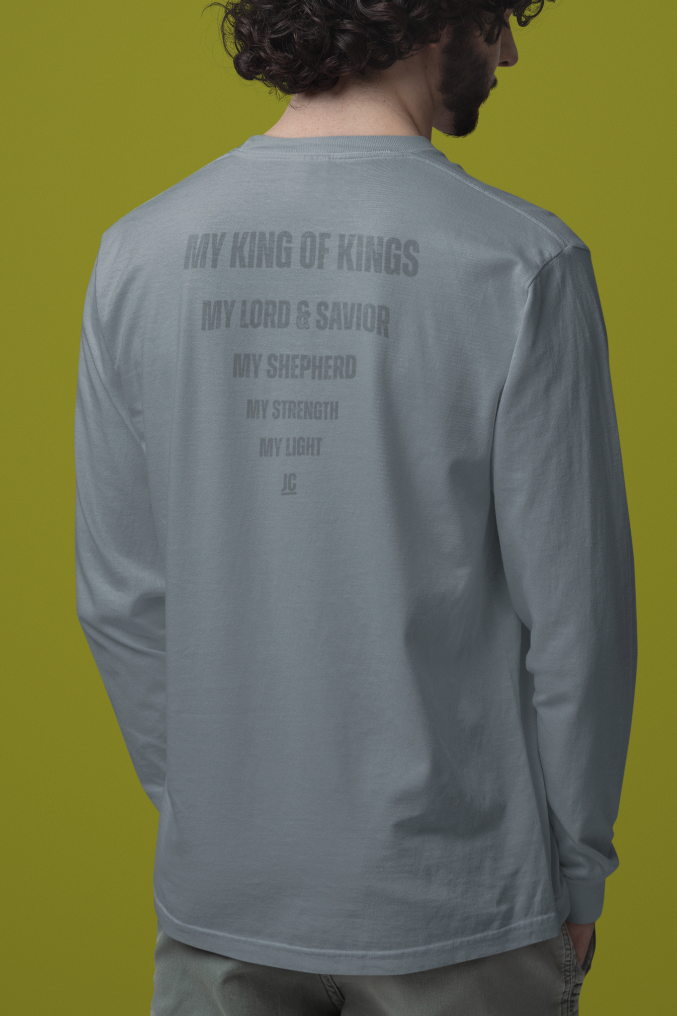 Premium Comfort Colors long sleeve with subtle faith-based back print design.