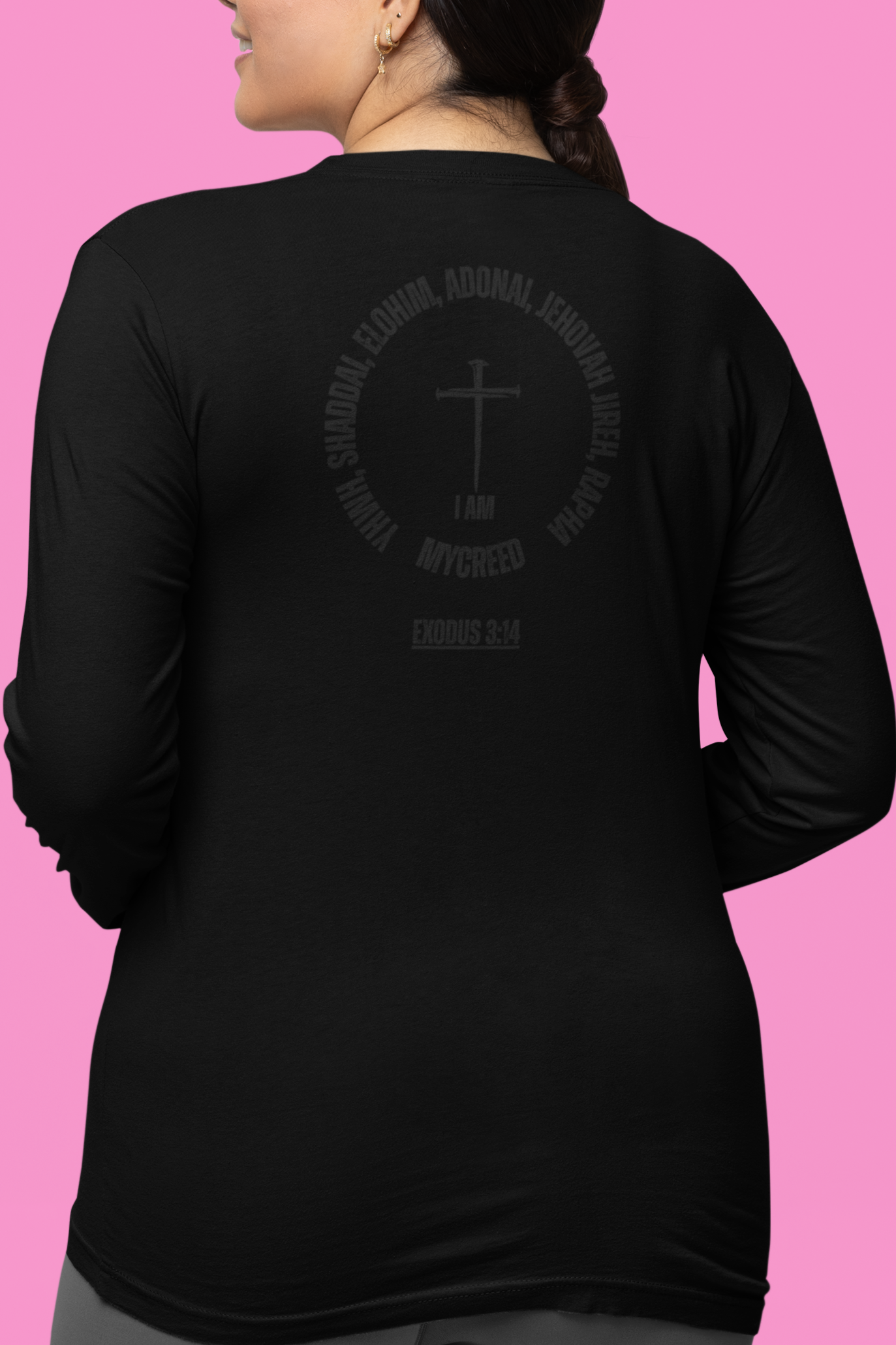 Back view of Bella+Canvas women’s long sleeve tee featuring “Names of God” Christian design, MyCreed apparel.