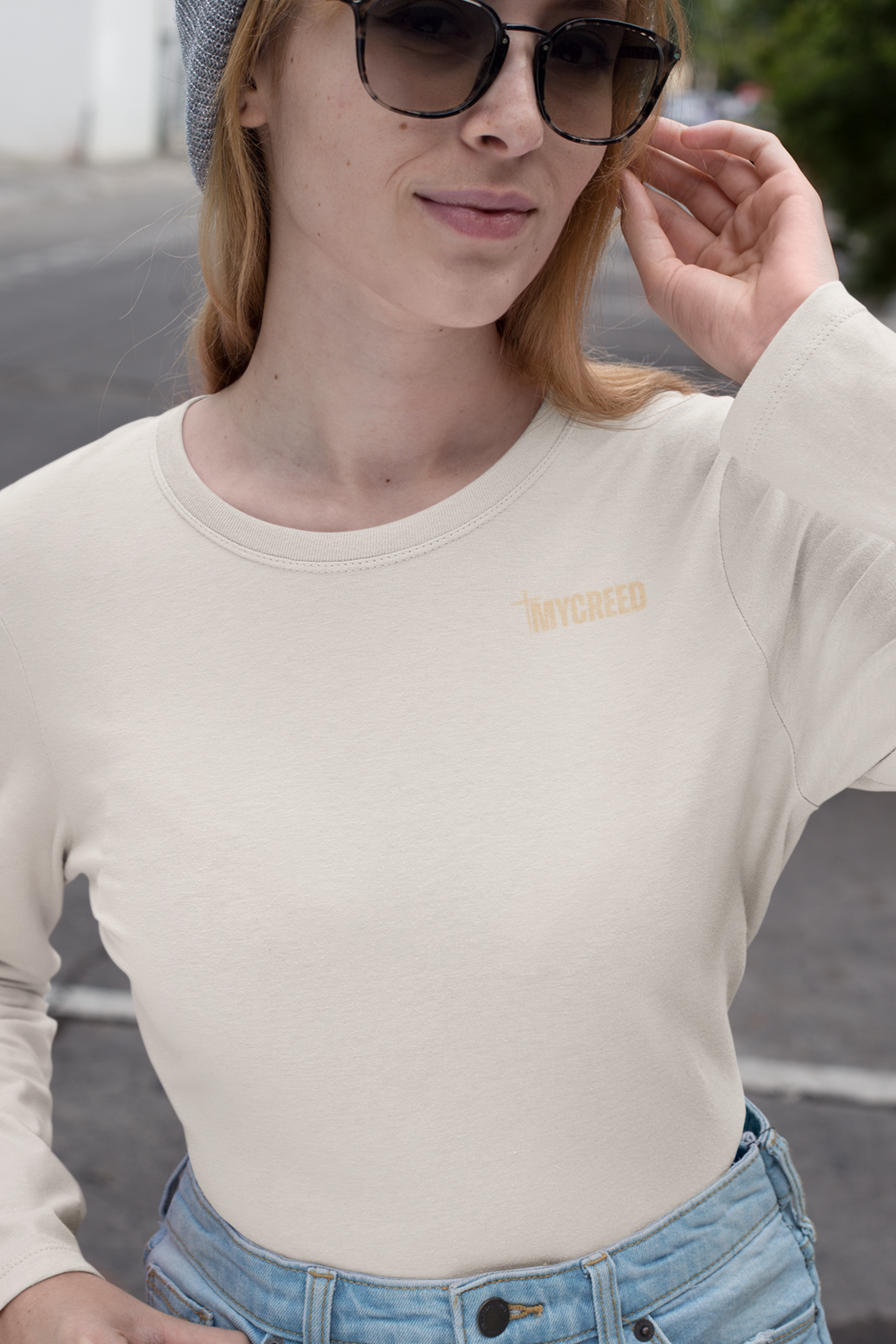 Front view of Bella+Canvas women’s long sleeve tee featuring “Names of God” Christian design, MyCreed apparel.