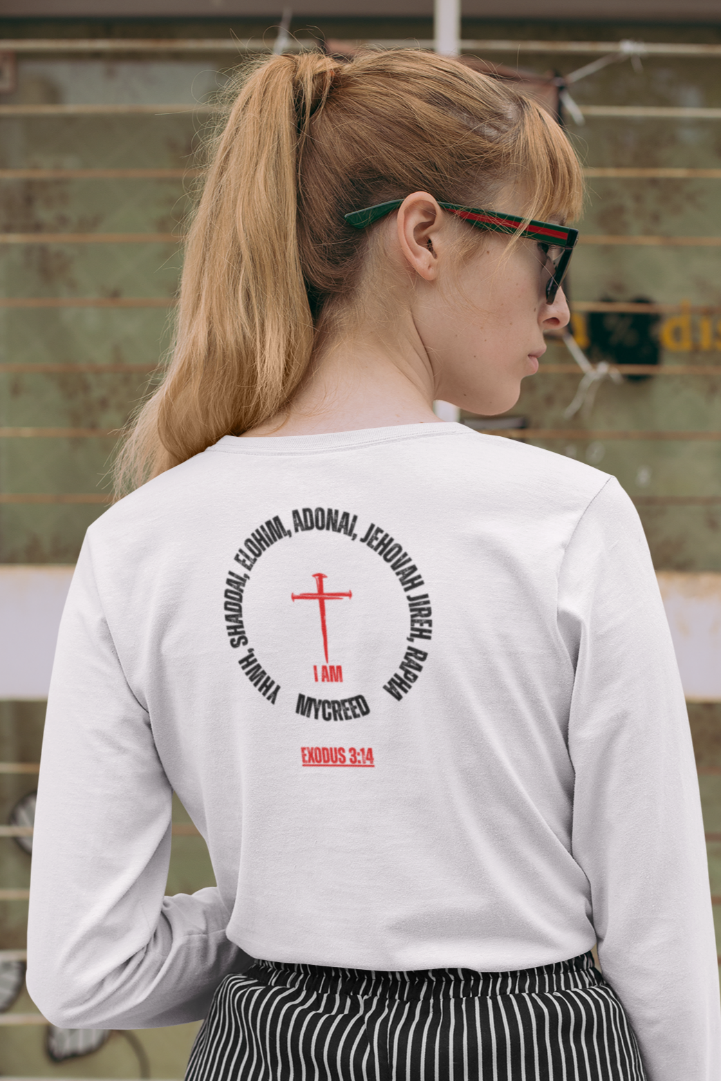 Women’s slim fit Christian long sleeve shirt with elegant “Names of God” graphic printed on the back.