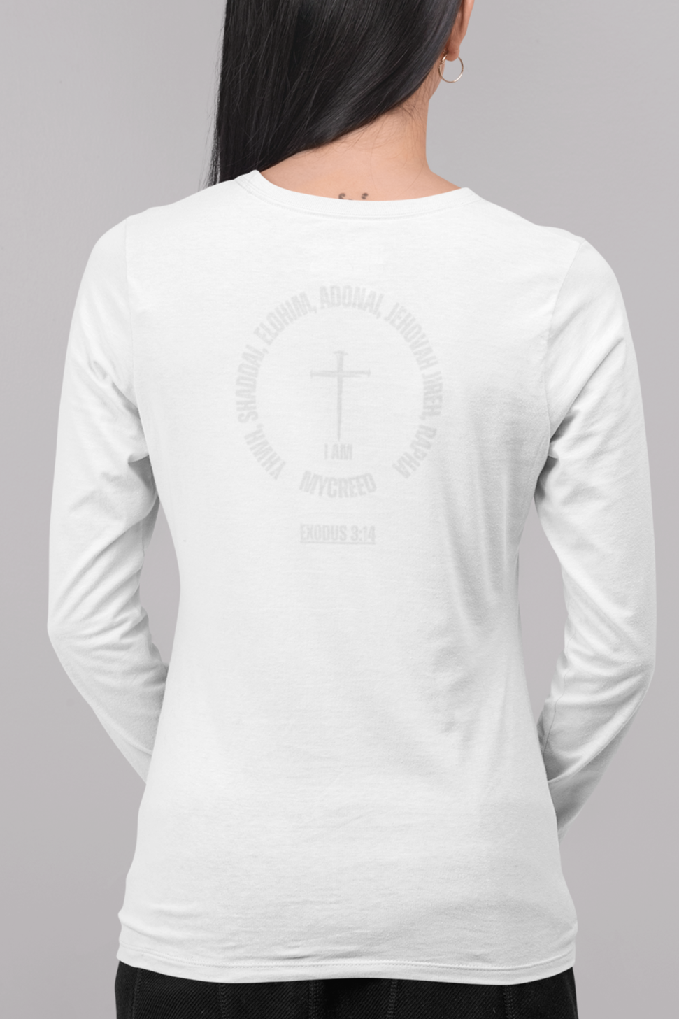 Faith-inspired women’s long sleeve tee by MyCreed, displaying names of God in modern graphic layout on rear print.