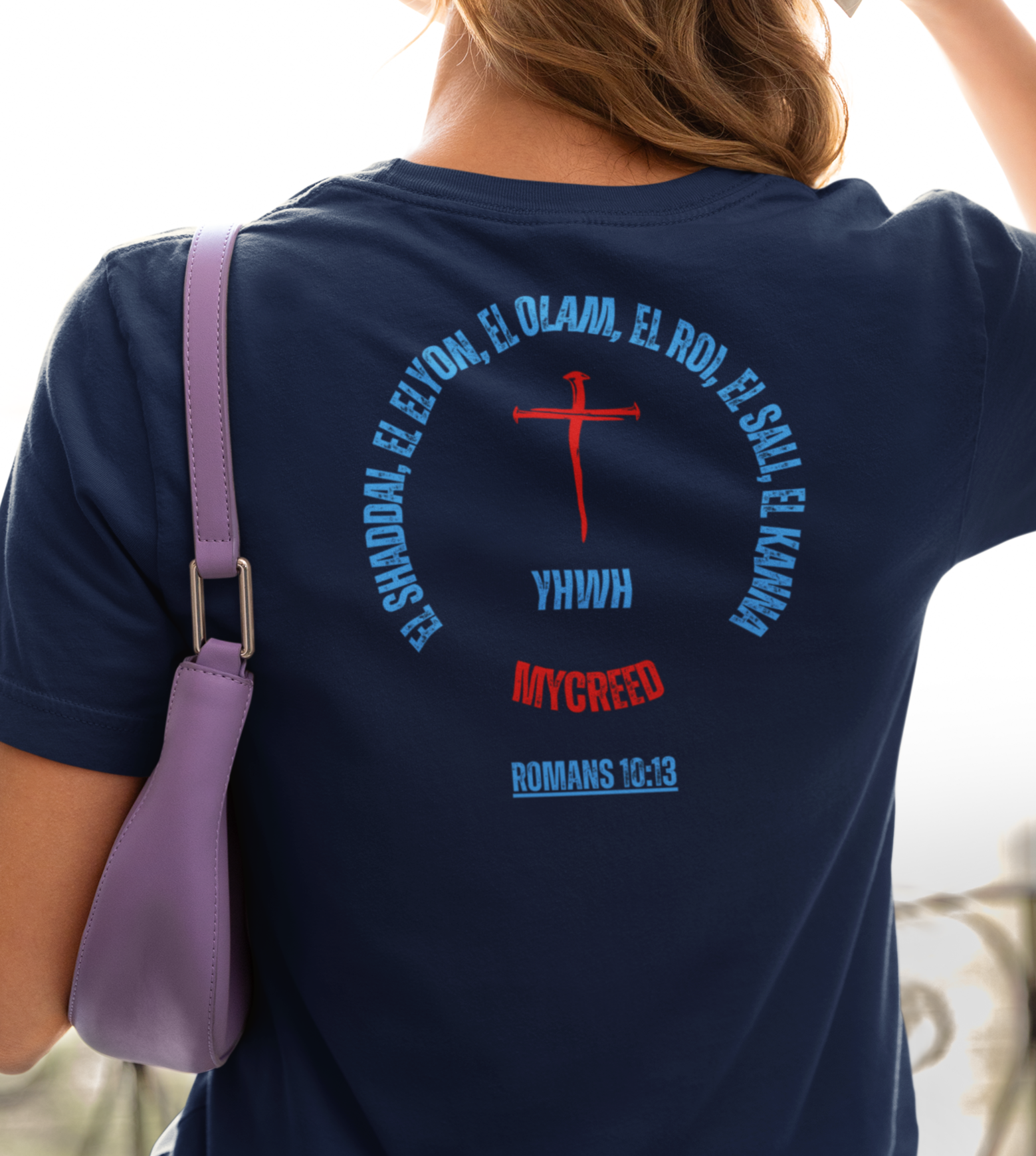 Navy slim fit Bella+Canvas women’s tee with YHWH’s Names scripture design and Romans 10:13 verse