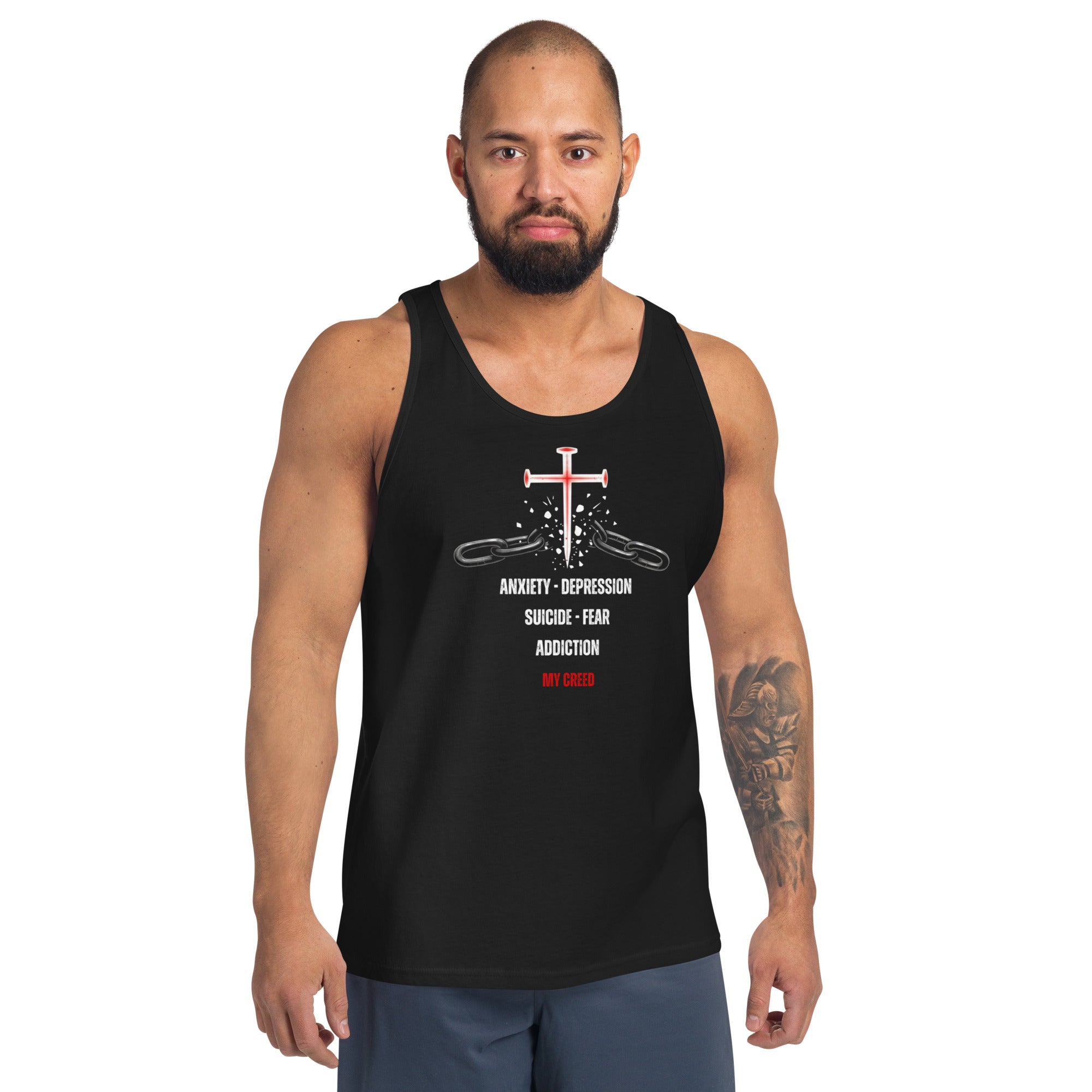 Male model wearing black ChainBreaker tank with cross breaking chains and John 8:36 scripture, front view by MyCreed™