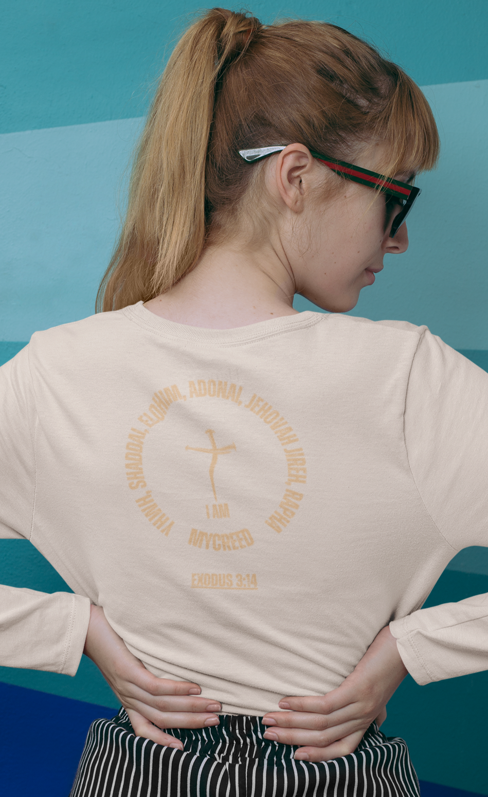 Women’s long sleeve Christian t-shirt styled with bold “Names of God” design on the back, everyday faithwear.