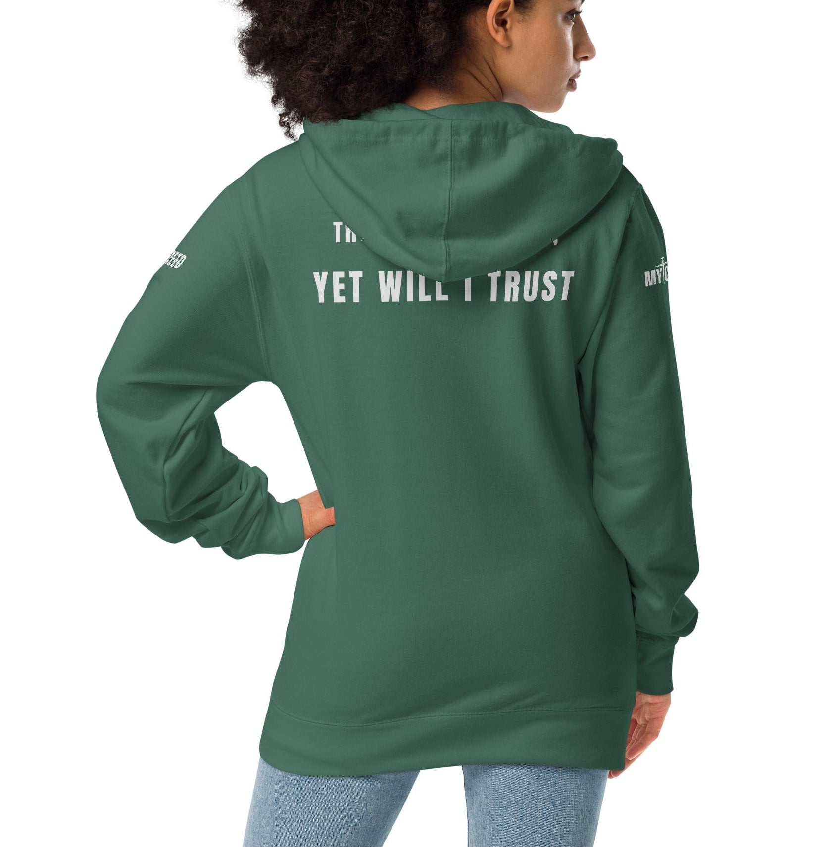 Alpine green zip-up hoodie worn by female model, back view with full “Yet Will I Trust” message visible by MyCreed™