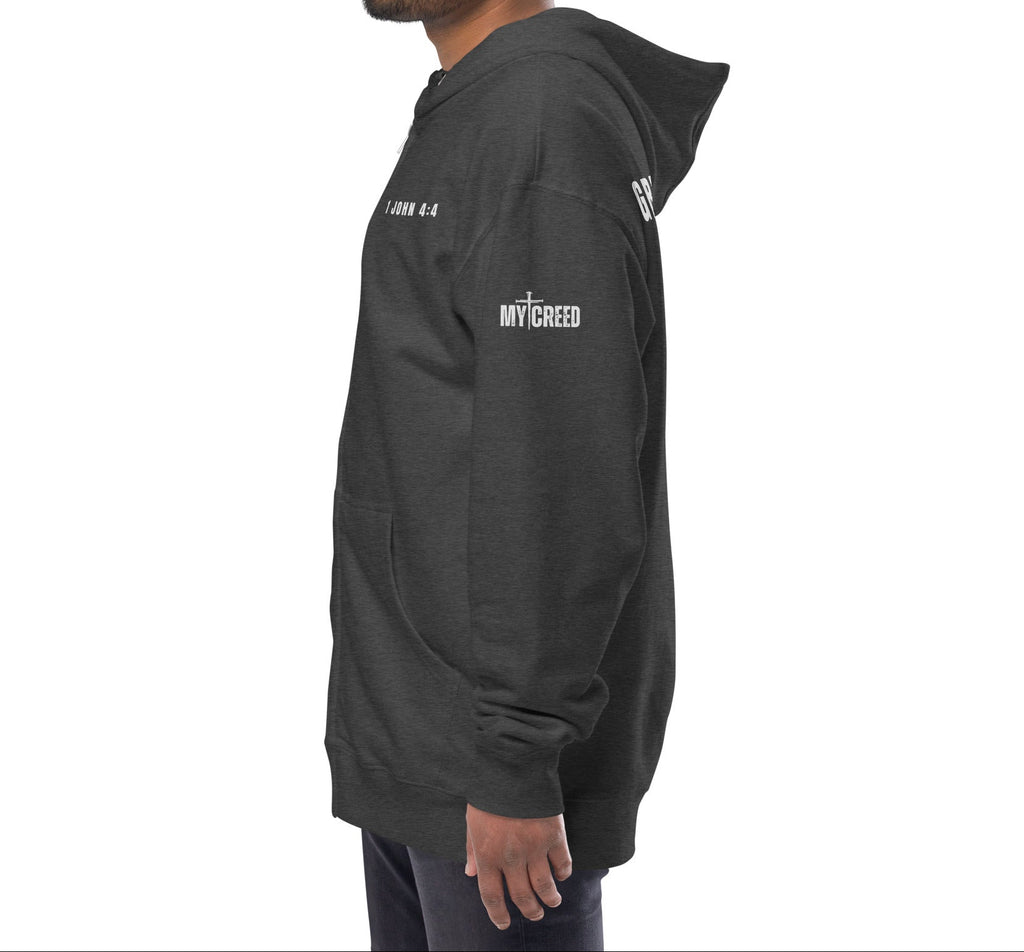 Charcoal heather zip-up hoodie on model, side view with left chest “1 JOHN 4:4” detail by MyCreed™