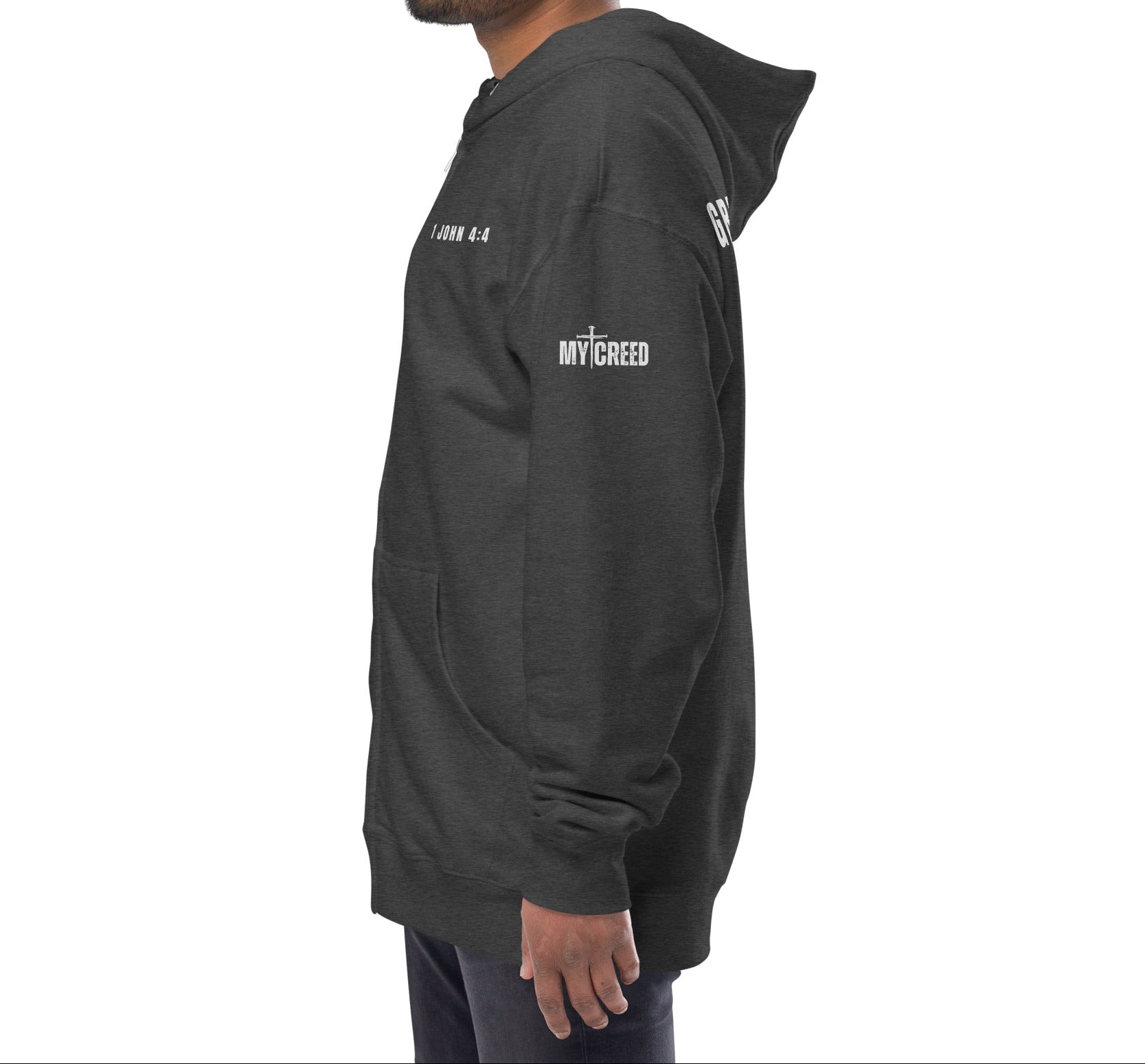 Charcoal heather zip-up hoodie on model, side view with left chest “1 JOHN 4:4” detail by MyCreed™