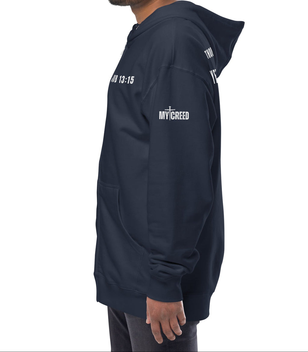 Navy zip-up hoodie worn by male model, left side profile showing clean My Creed logo, by MyCreed™