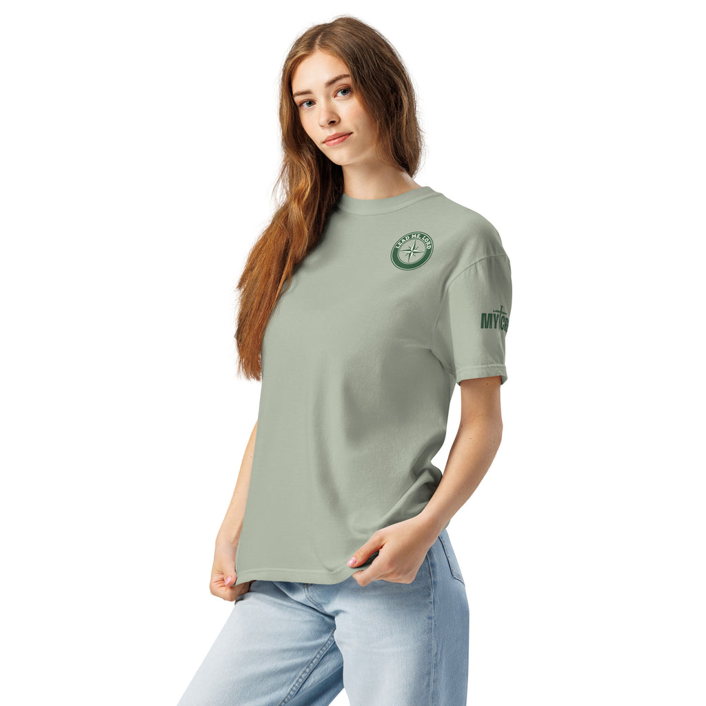 Lifestyle photo of woman wearing bay green Comfort Colors t-shirt with front chest emblem visible, by MyCreed™