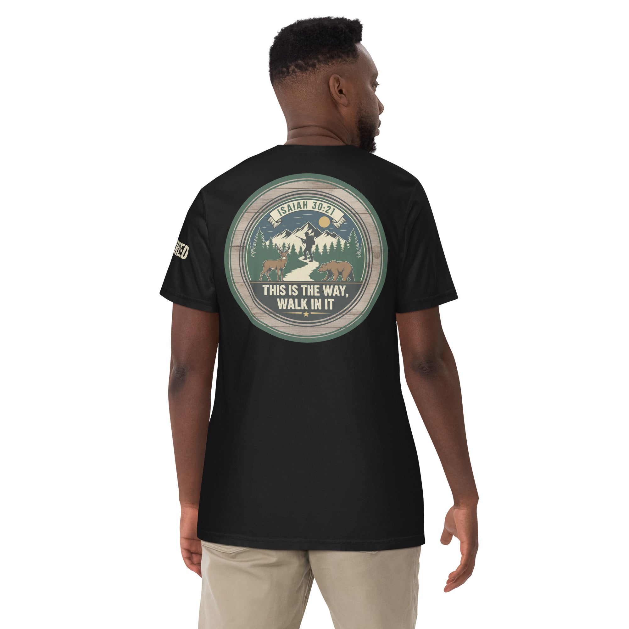 Lifestyle back view of man wearing black Comfort Colors tee with full scripture circle design visible, by MyCreed™