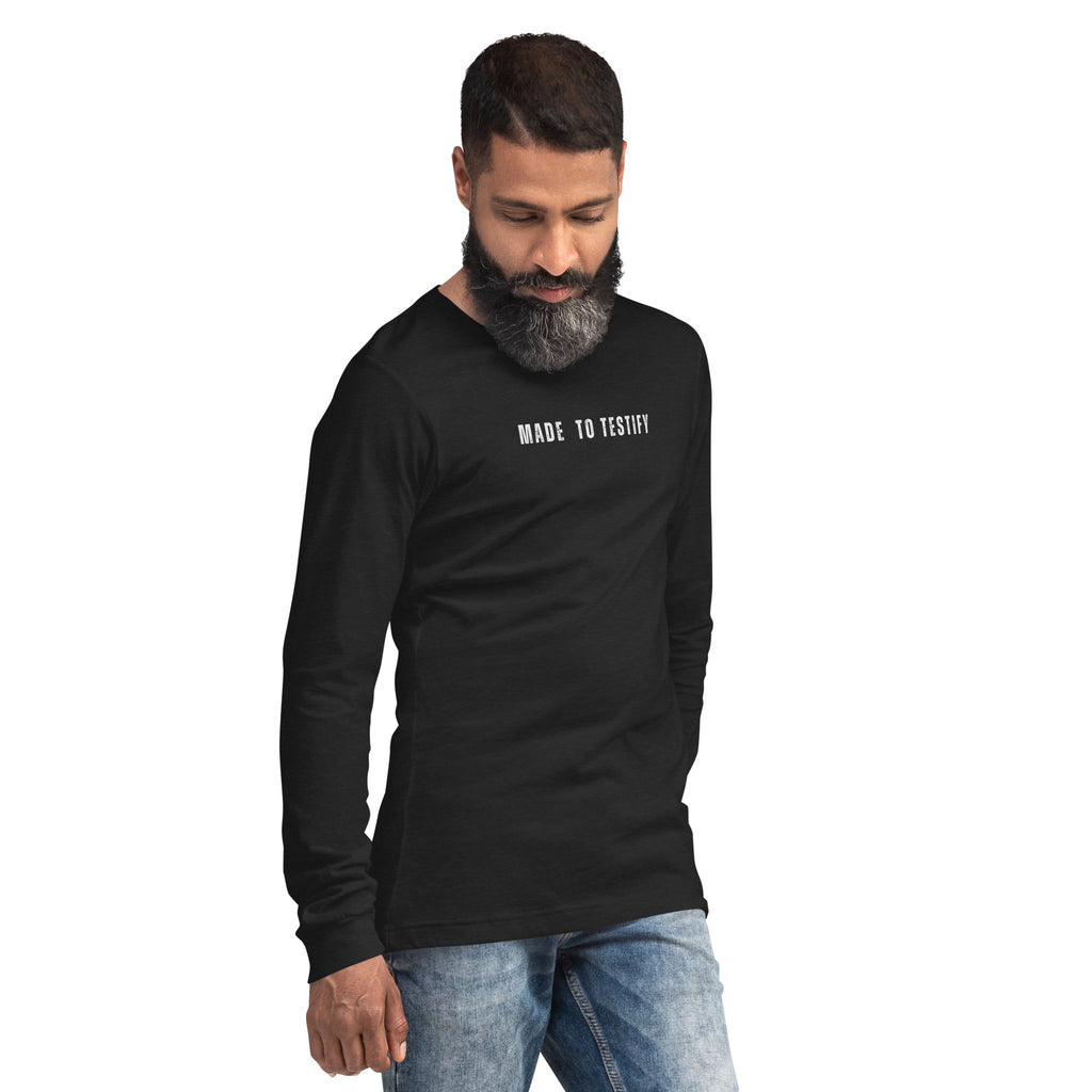 Male model wearing black Christian long sleeve tee with subtle chest text, modern faith lifestyle apparel by MyCreed™