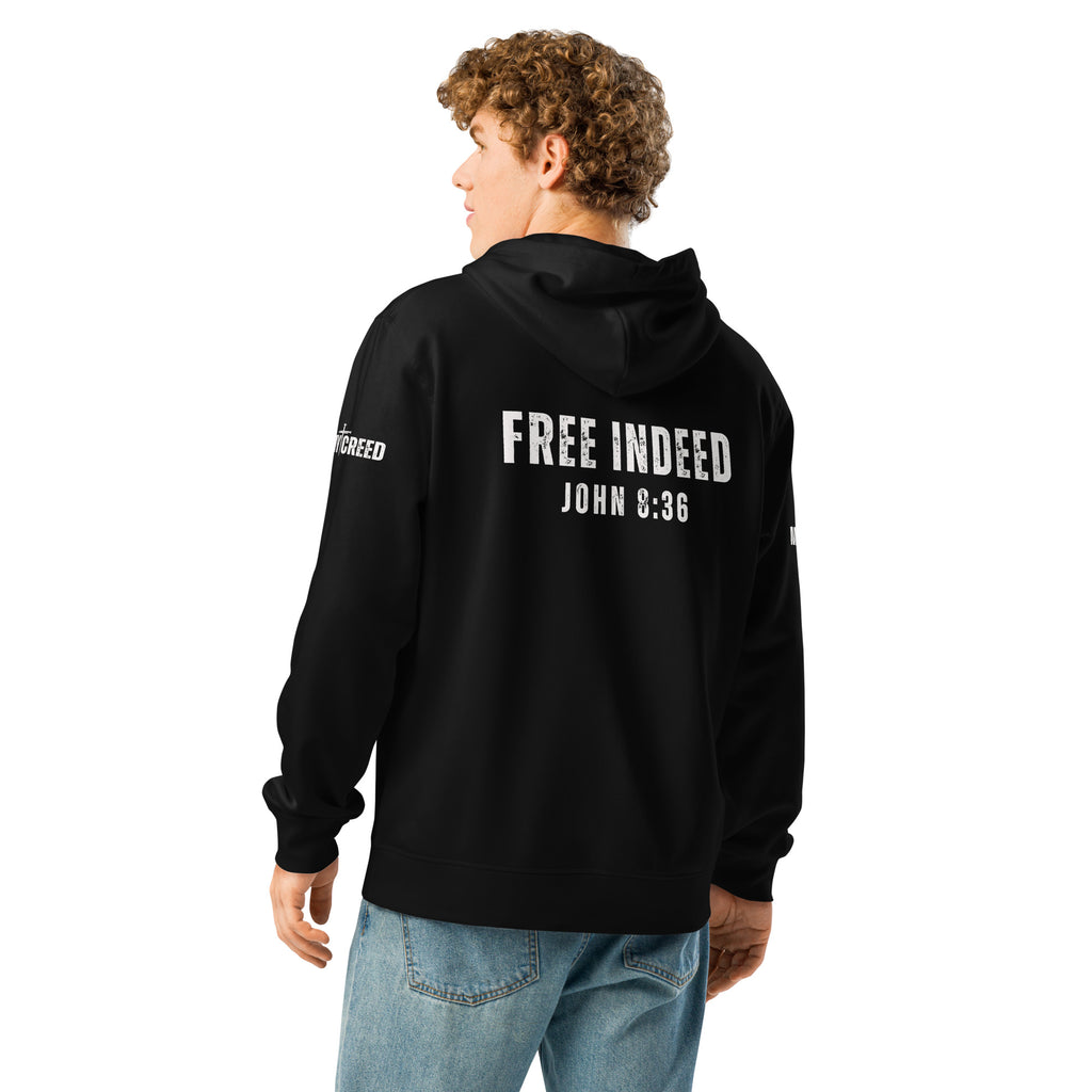 Male model wearing black ChainBreaker hoodie showing “FREE INDEED” John 8:36 back print by MyCreed™