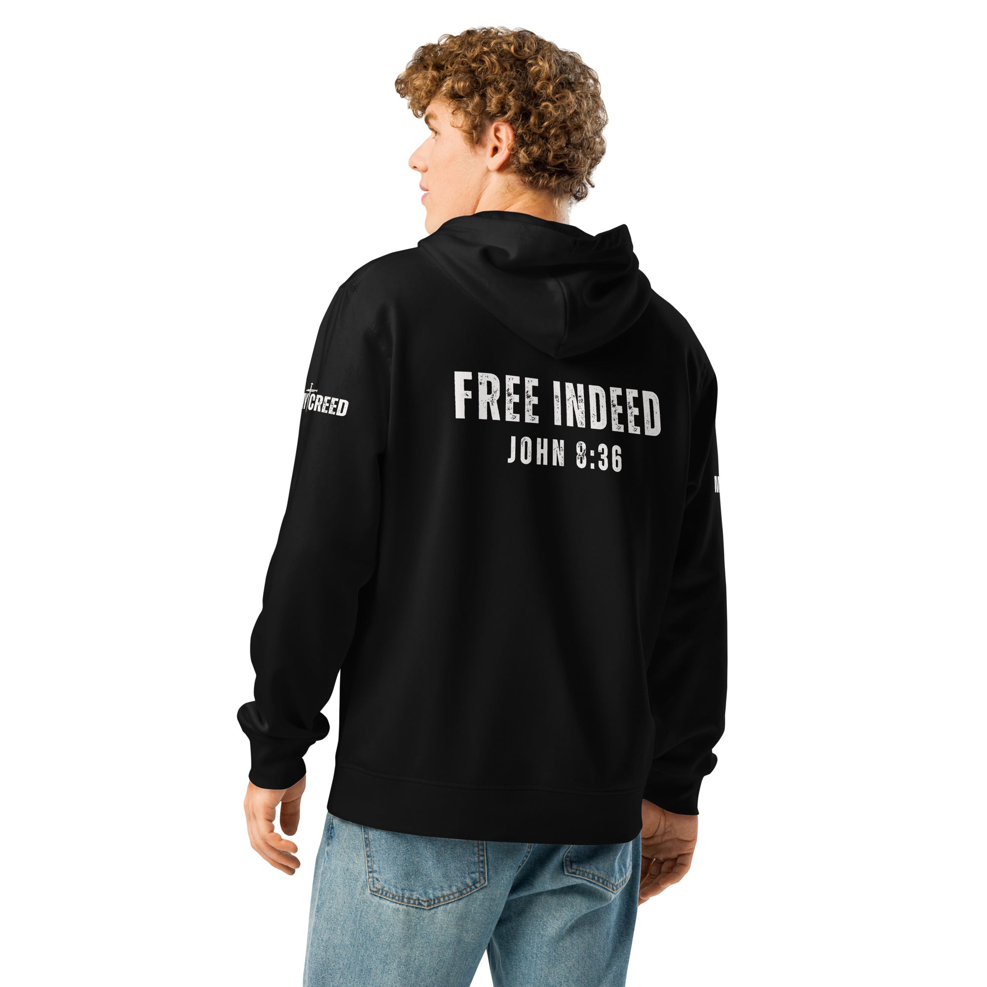 Male model wearing black ChainBreaker hoodie showing “FREE INDEED” John 8:36 back print by MyCreed™