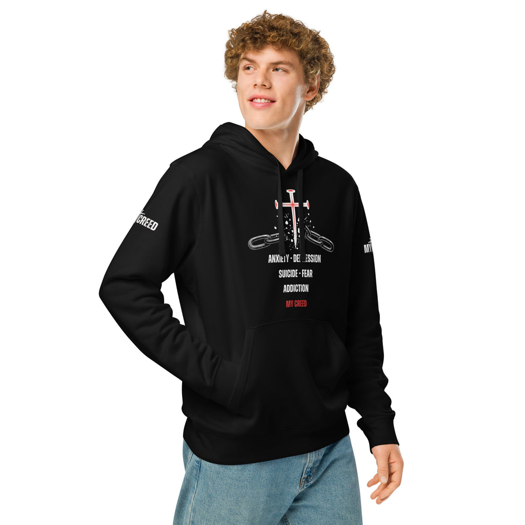 Male model wearing black ChainBreaker hoodie with cross-and-chains front graphic and red accents by MyCreed™