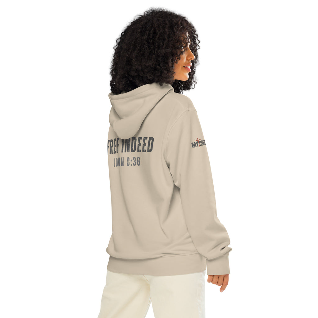 Female model wearing dust ChainBreaker hoodie showing “FREE INDEED” John 8:36 back print by MyCreed™