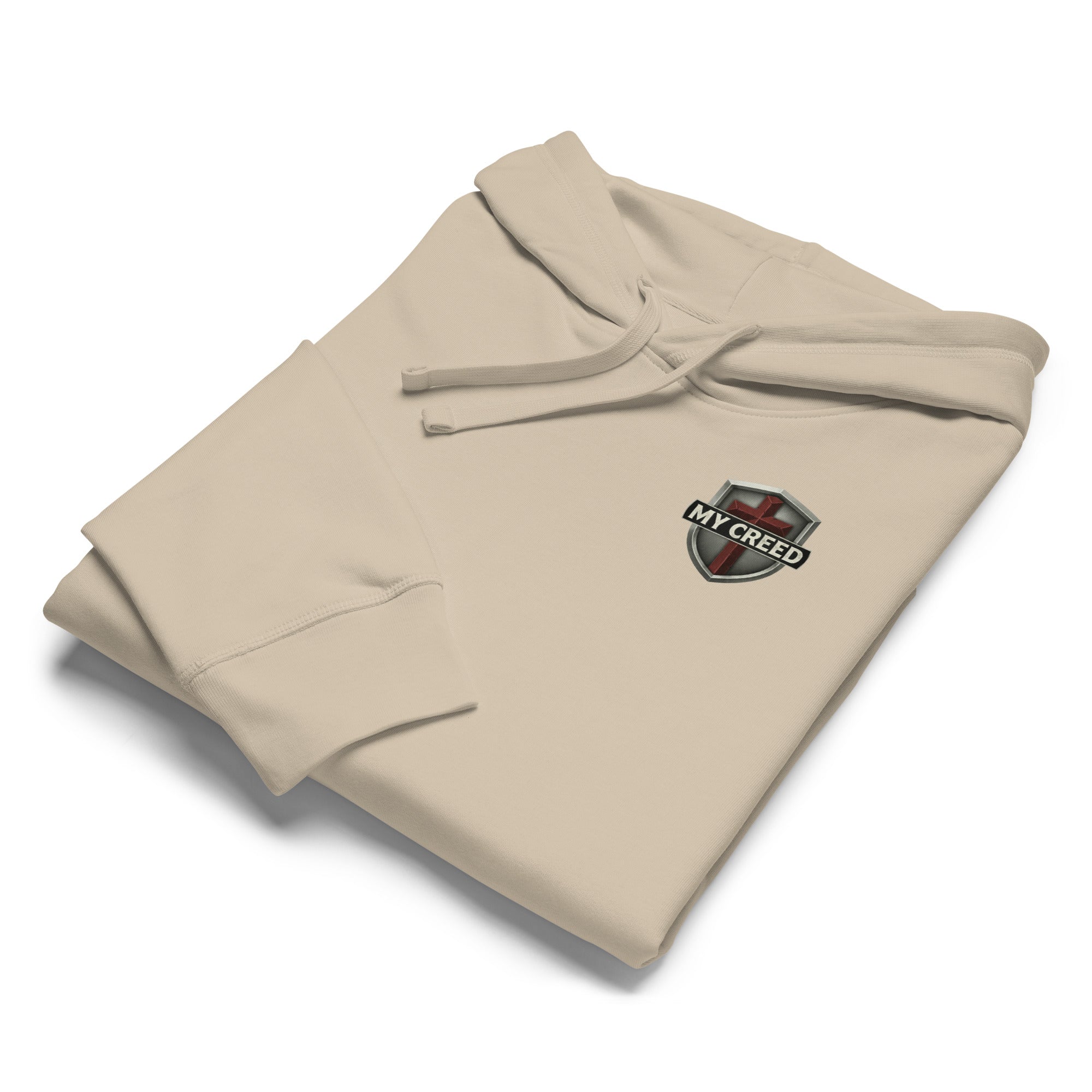 Folded dust Stanley/Stella hoodie product flat-lay with small MyCreed crest visible by MyCreed™