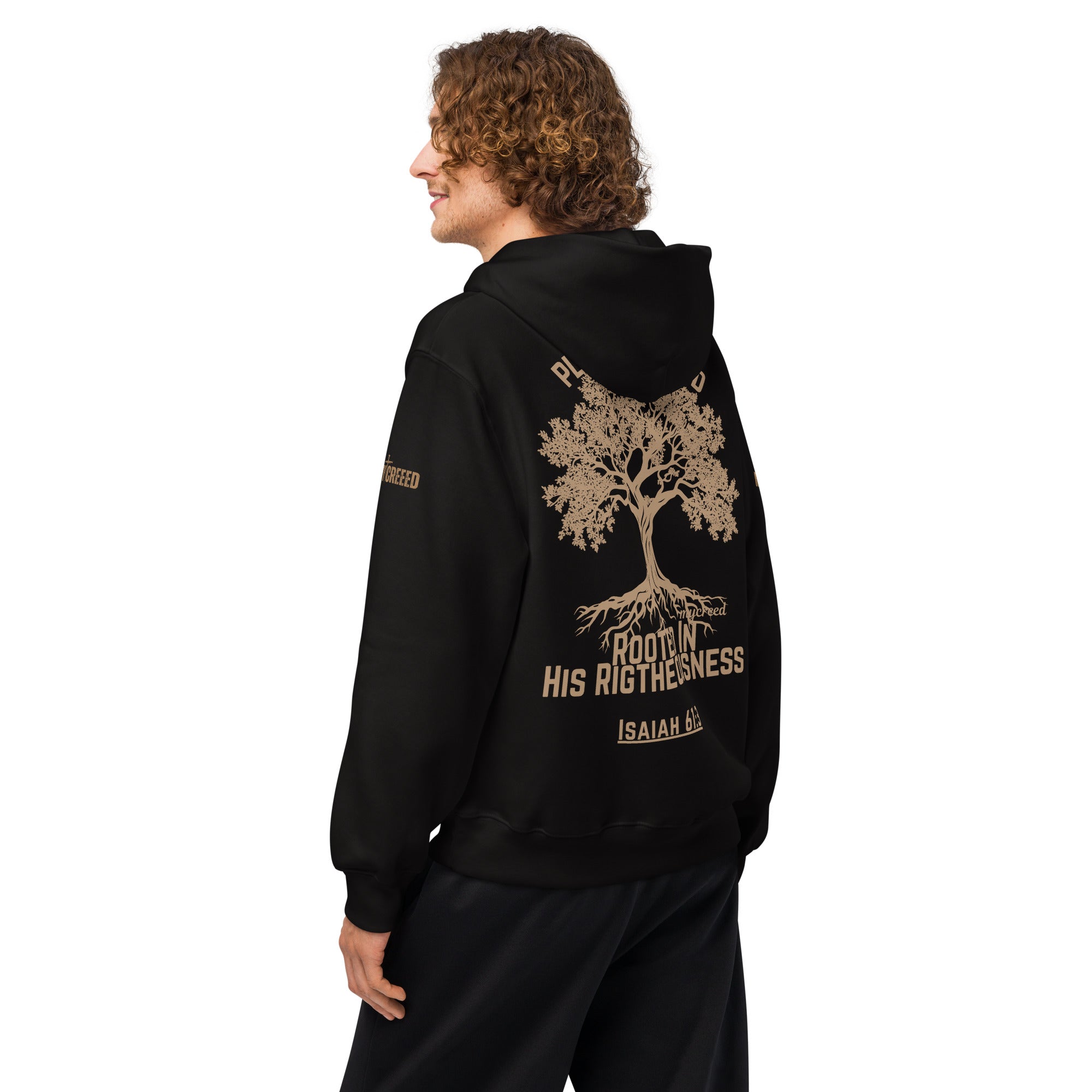 Male model wearing black hoodie, back angled view showing large tree back print by MyCreed™