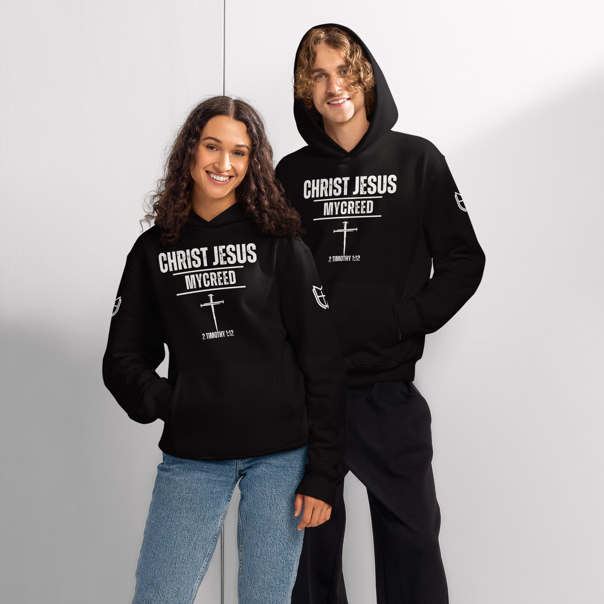 Black Bella + Canvas 4719 hoodies worn by male and female models expressing faith-forward streetwear, by MyCreed™