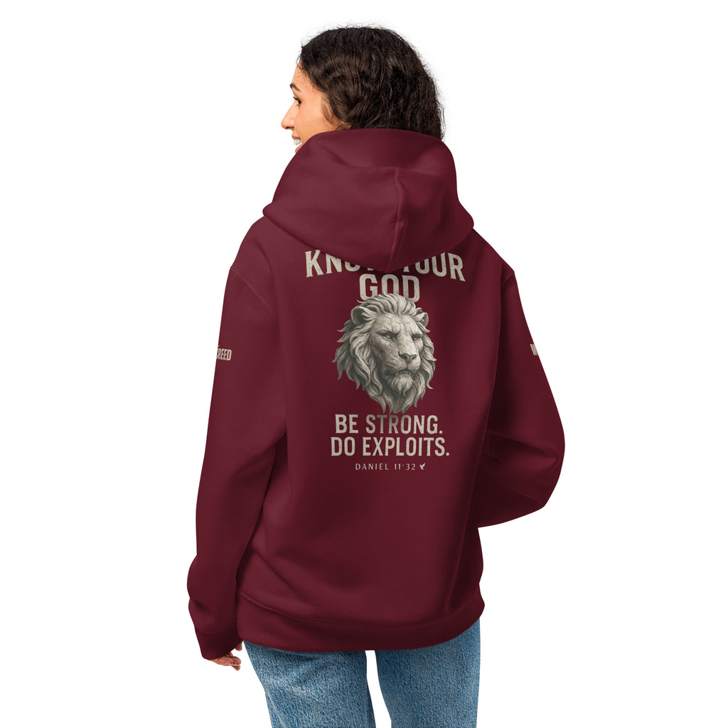 Female model wearing Inspirational Christian maroon hoodie with back view Daniel 11:32 verse and bold lion artwork by MyCreed™