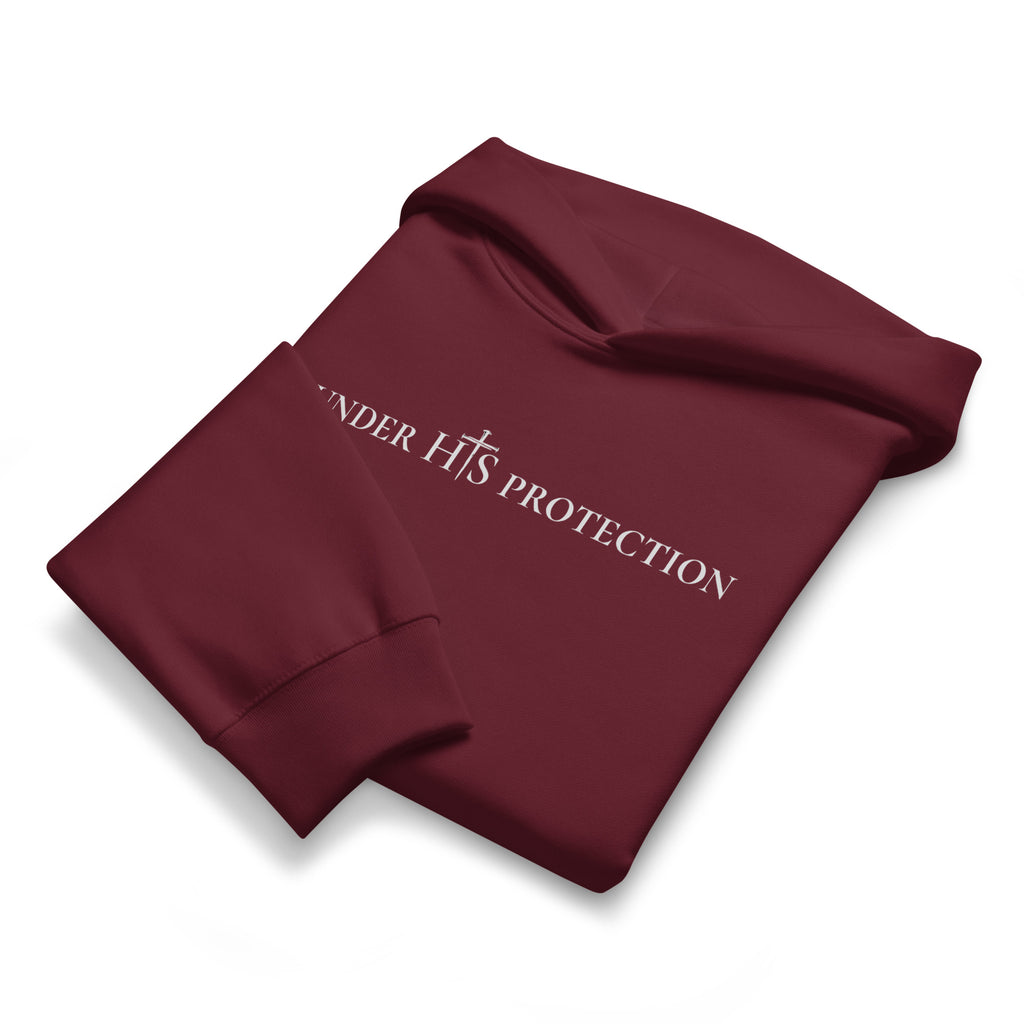 Folded maroon hoodie showing chest scripture print and ribbed cuff construction, by MyCreed™