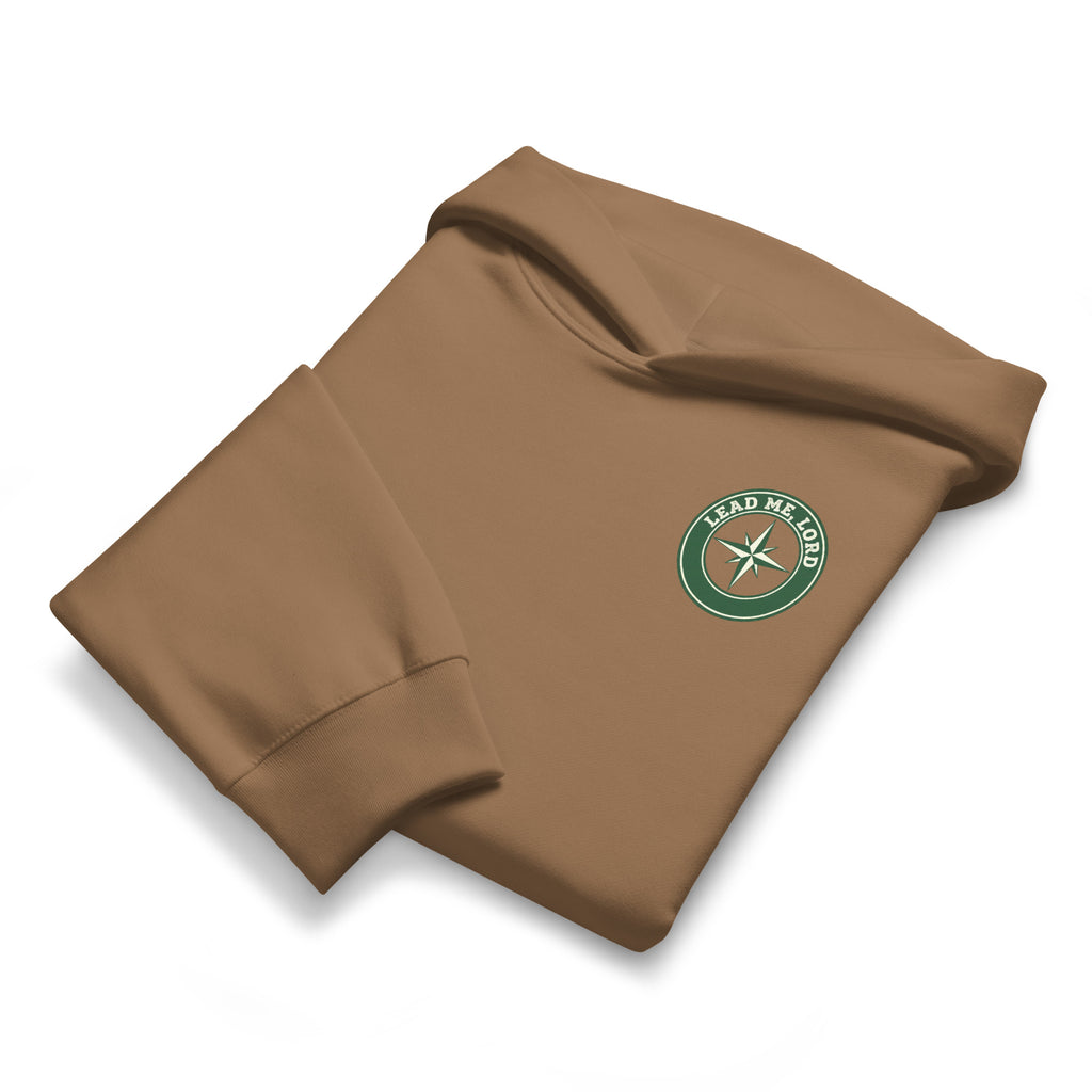 Folded vintage brown hoodie highlighting chest emblem and premium fabric texture, by MyCreed™