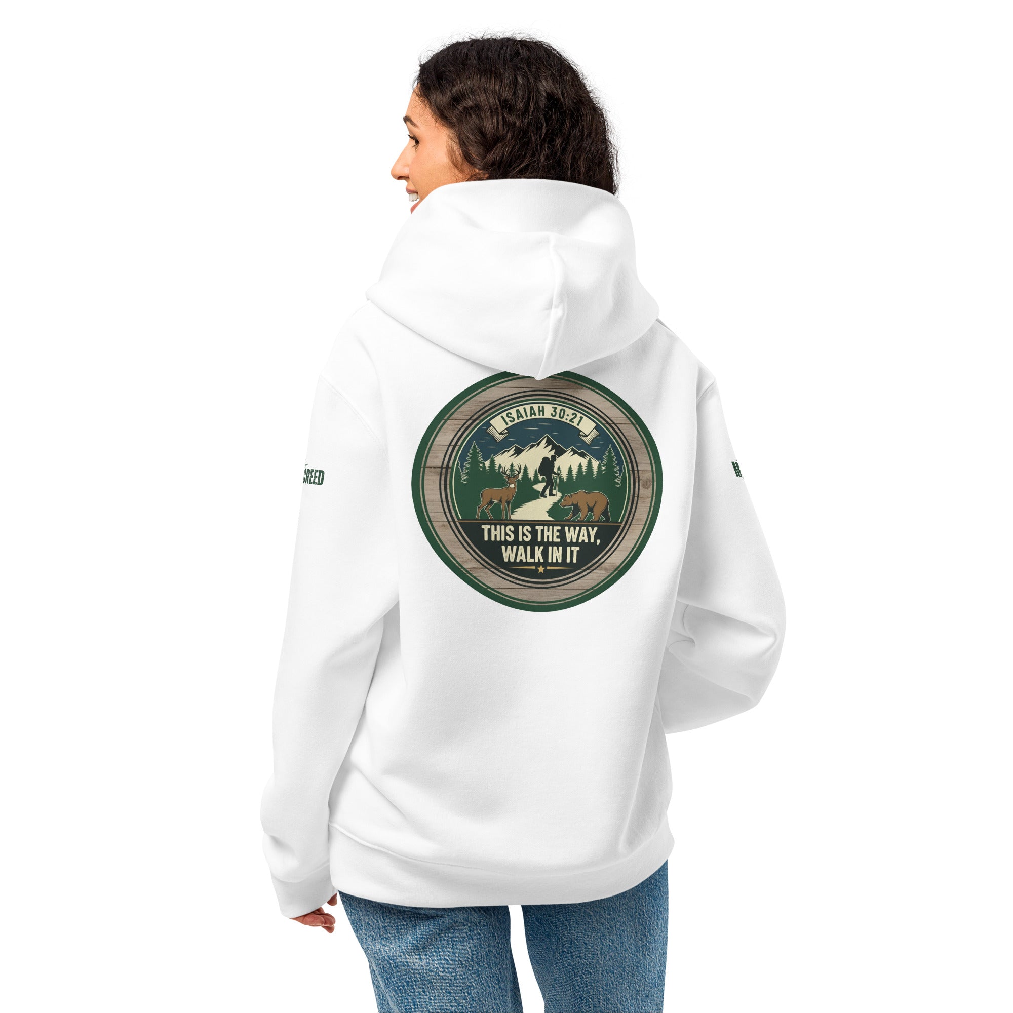 Lifestyle image of woman wearing white This Is The Way hoodie with back scripture design visible, by MyCreed™