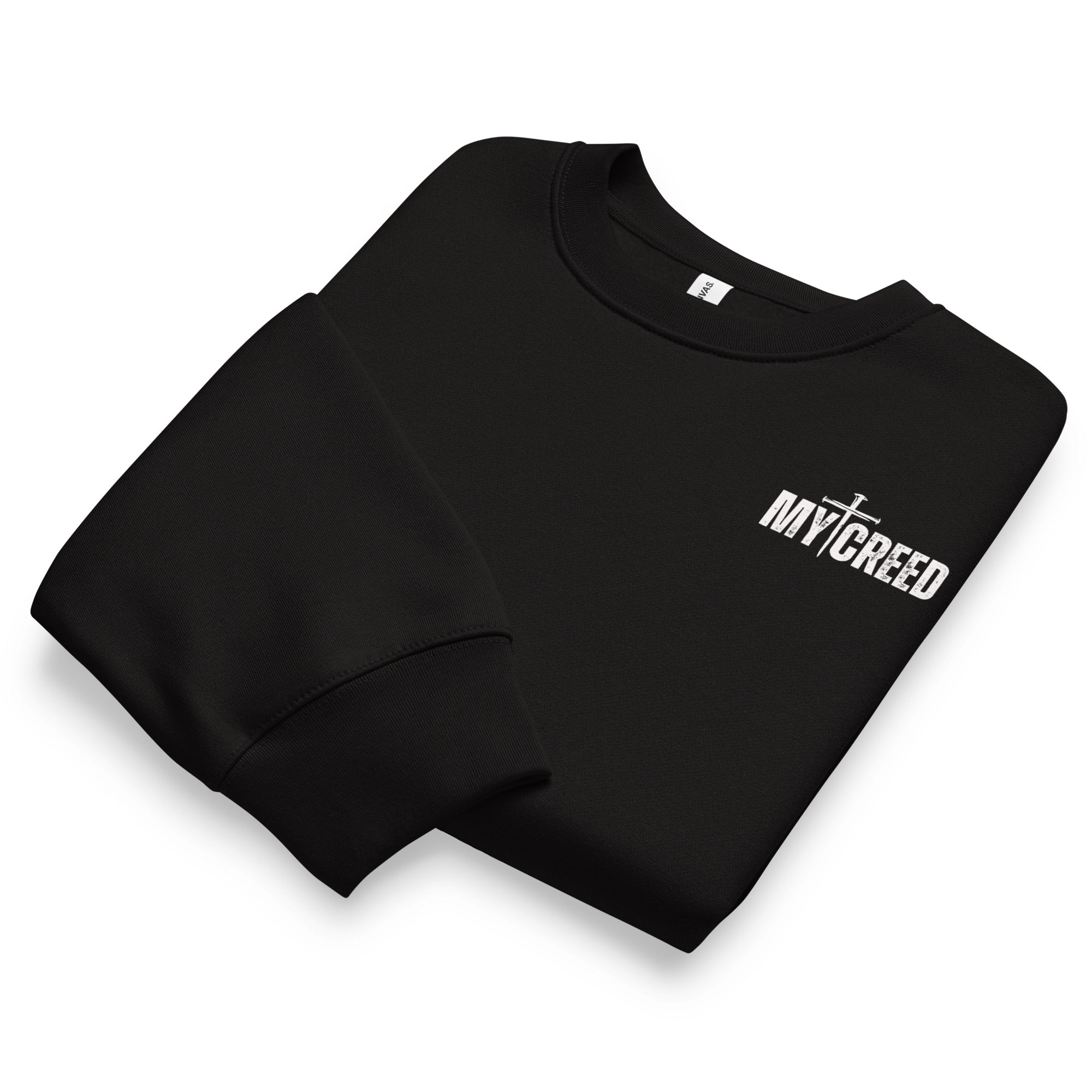 Folded black Bella+Canvas 4711 oversized sweatshirt showing premium fabric and MyCreed chest branding, by MyCreed™