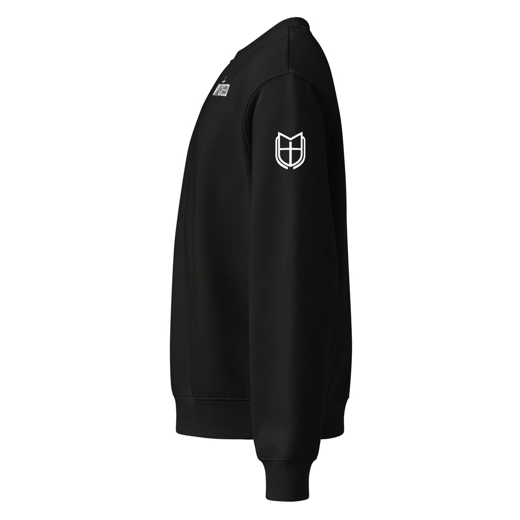 Black Bella+Canvas crewneck sweatshirt side view highlighting sleeve emblem and structured silhouette, by MyCreed™