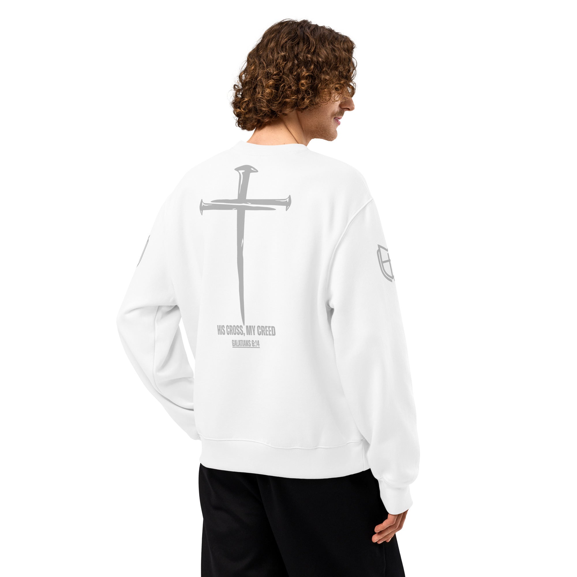 White Bella+Canvas sweatshirt worn by model, back view displaying cross-centered His Cross, My Creed design, by MyCreed™