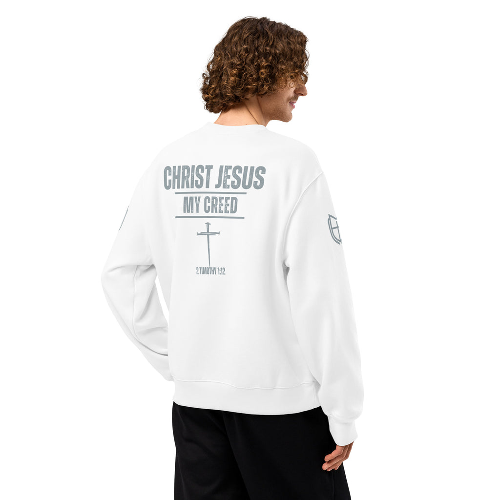 Back view of white Bella+Canvas 4711 oversized sweatshirt worn by model displaying Christ Jesus | My Creed message, by MyCreed™