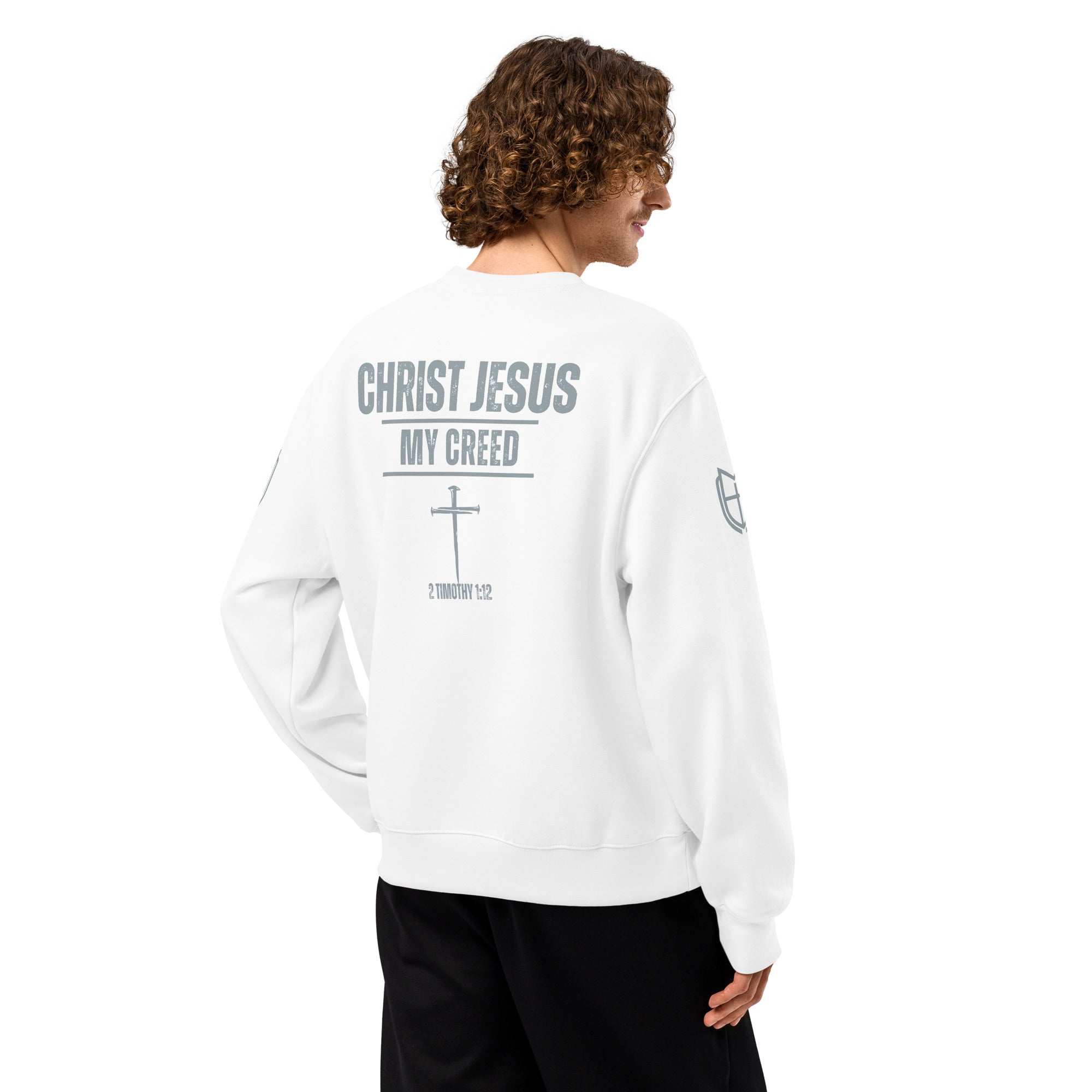 Back view of white Bella+Canvas 4711 oversized sweatshirt worn by model displaying Christ Jesus | My Creed message, by MyCreed™