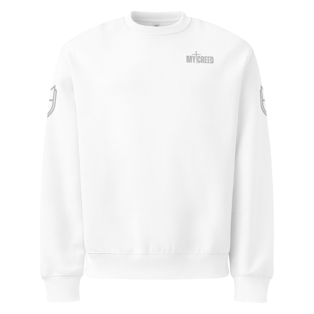 White Bella+Canvas sweatshirt front view showing clean minimalist front with subtle MyCreed chest branding, by MyCreed™