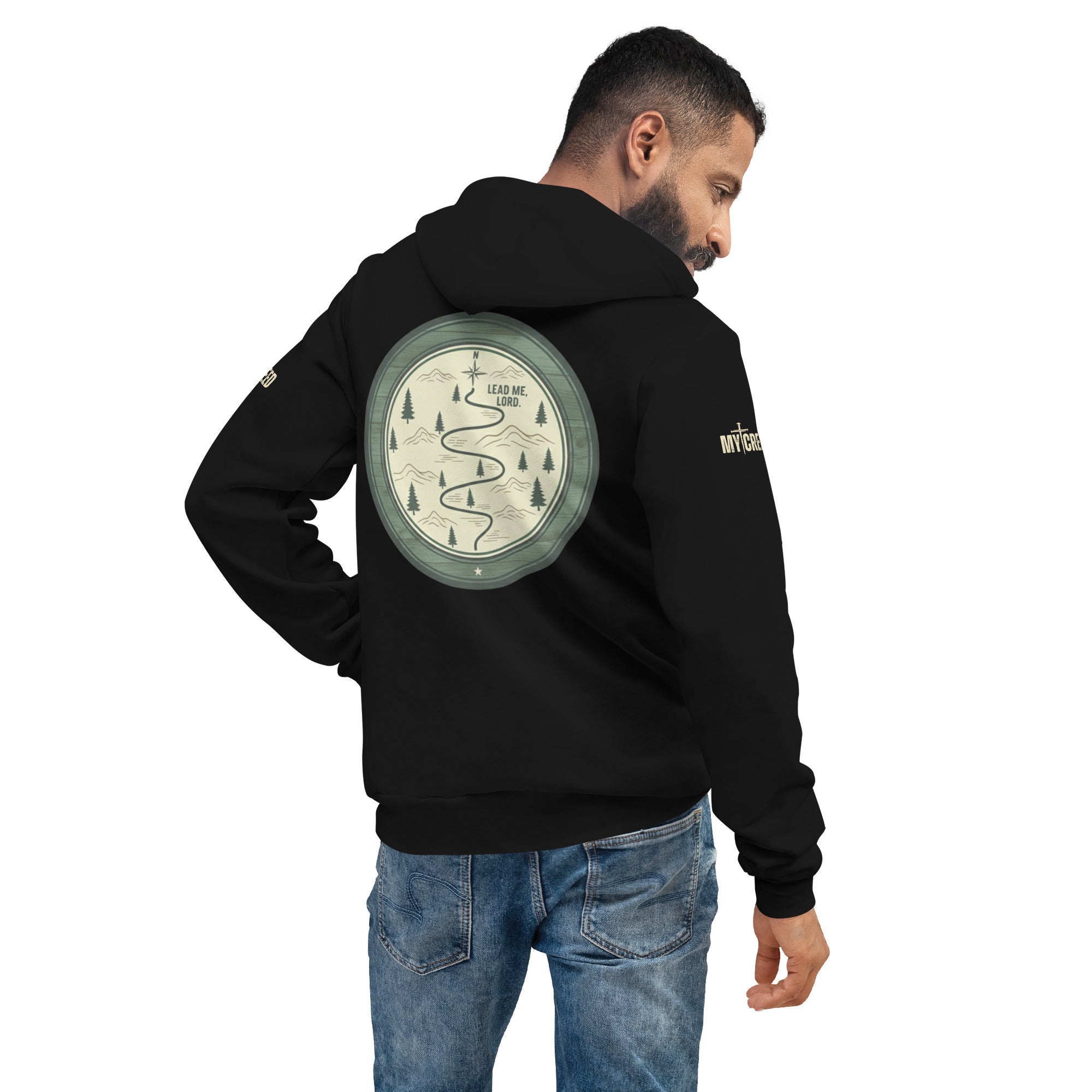 Male model wearing black unisex hoodie rear angled view emphasizing back graphic placement, by MyCreed™
