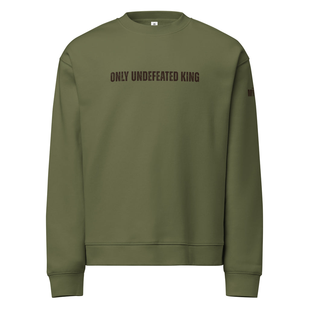 Cypress green Christian crewneck sweatshirt with Only Undefeated King text displayed flat, front view by MyCreed™
